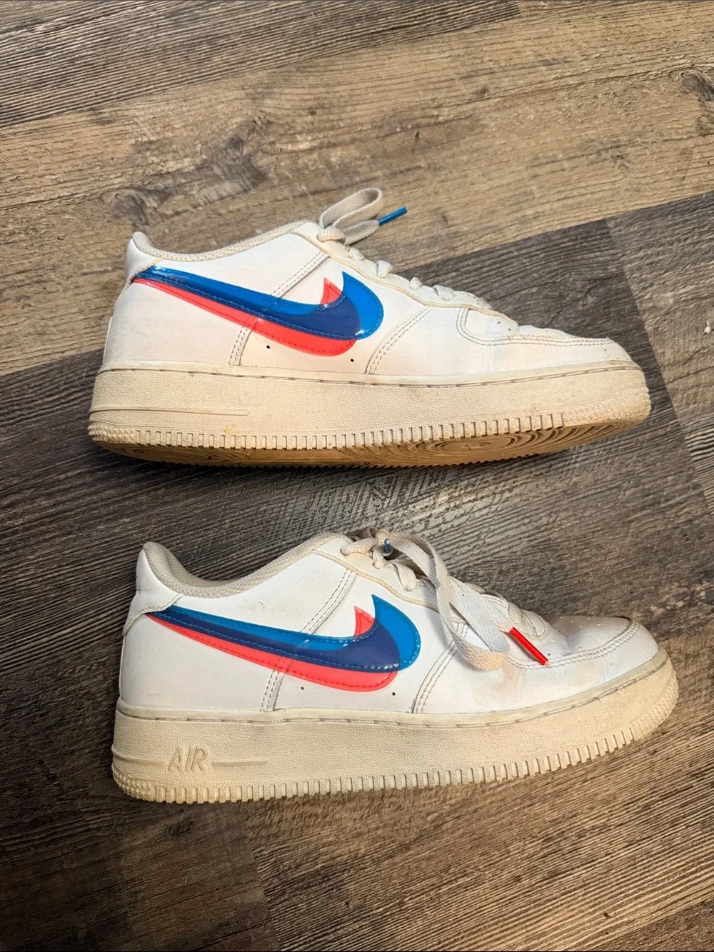 Nike White Low-Top Sneakers with Blue and Red Swoosh